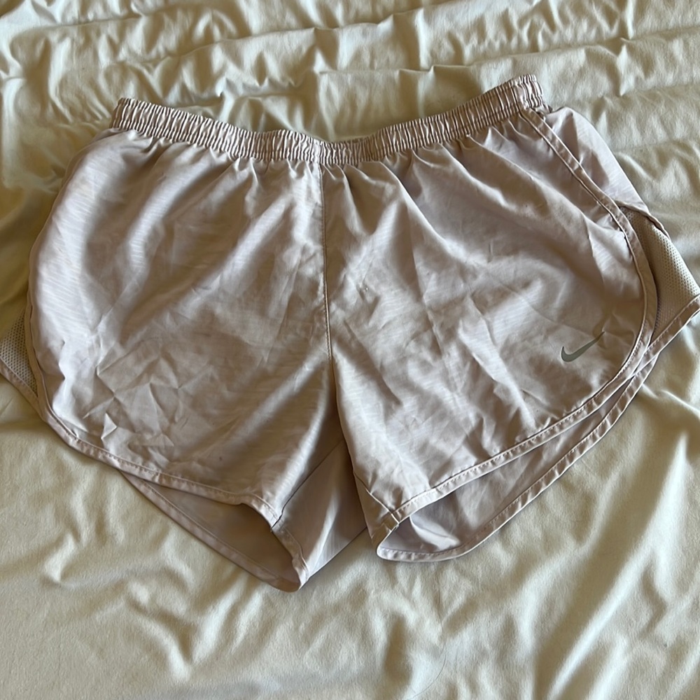Nike running shorts in lavender color.